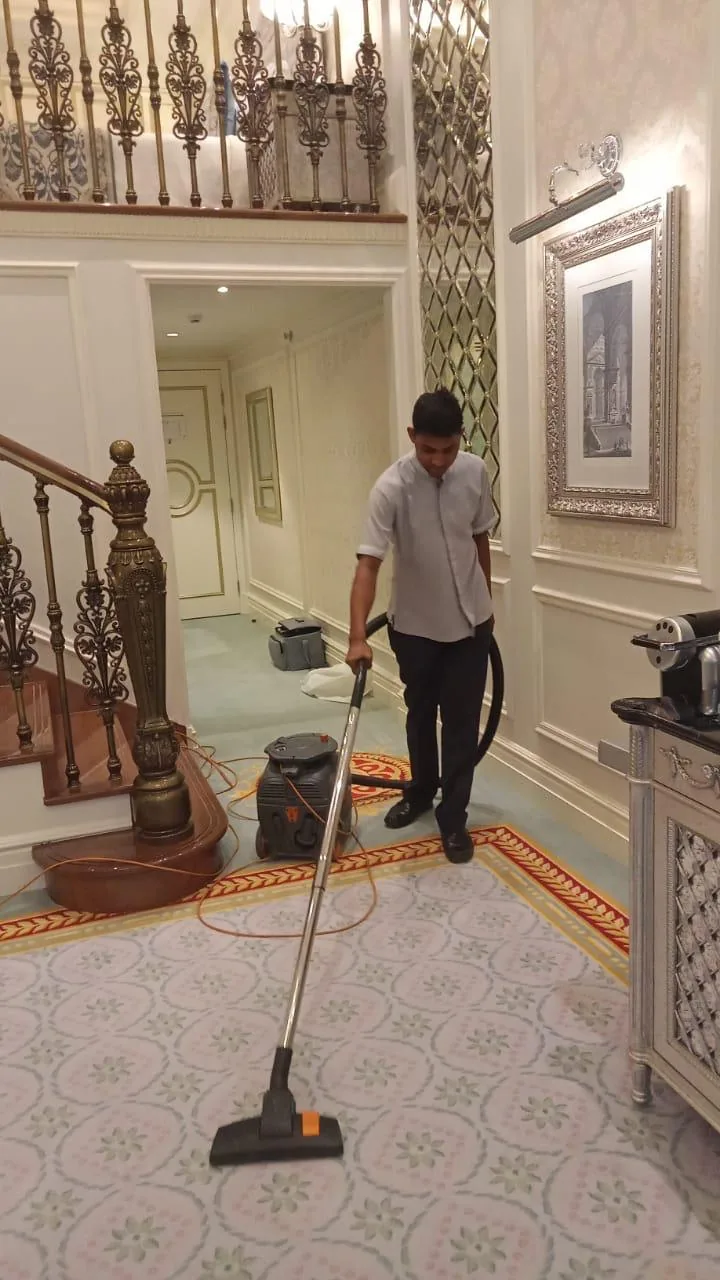 Carpet vacuuming in a hallway