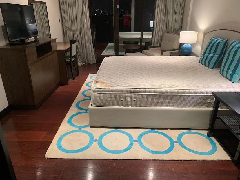 Bedroom with carpet laid over flooring