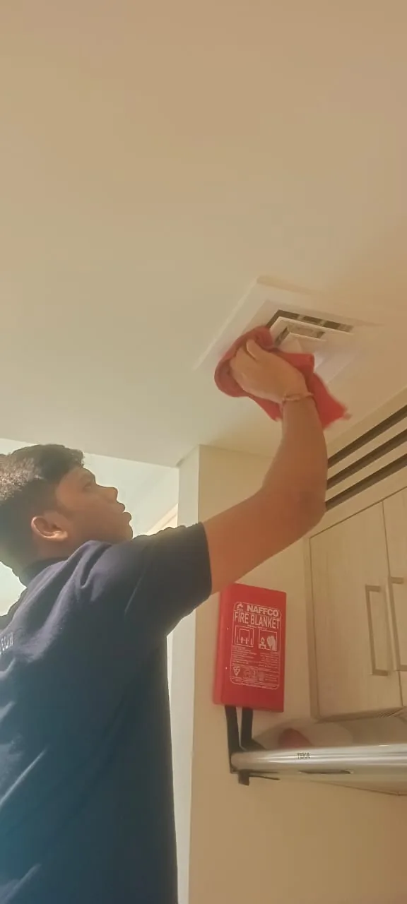 Wiping down a ceiling vent and extract grille