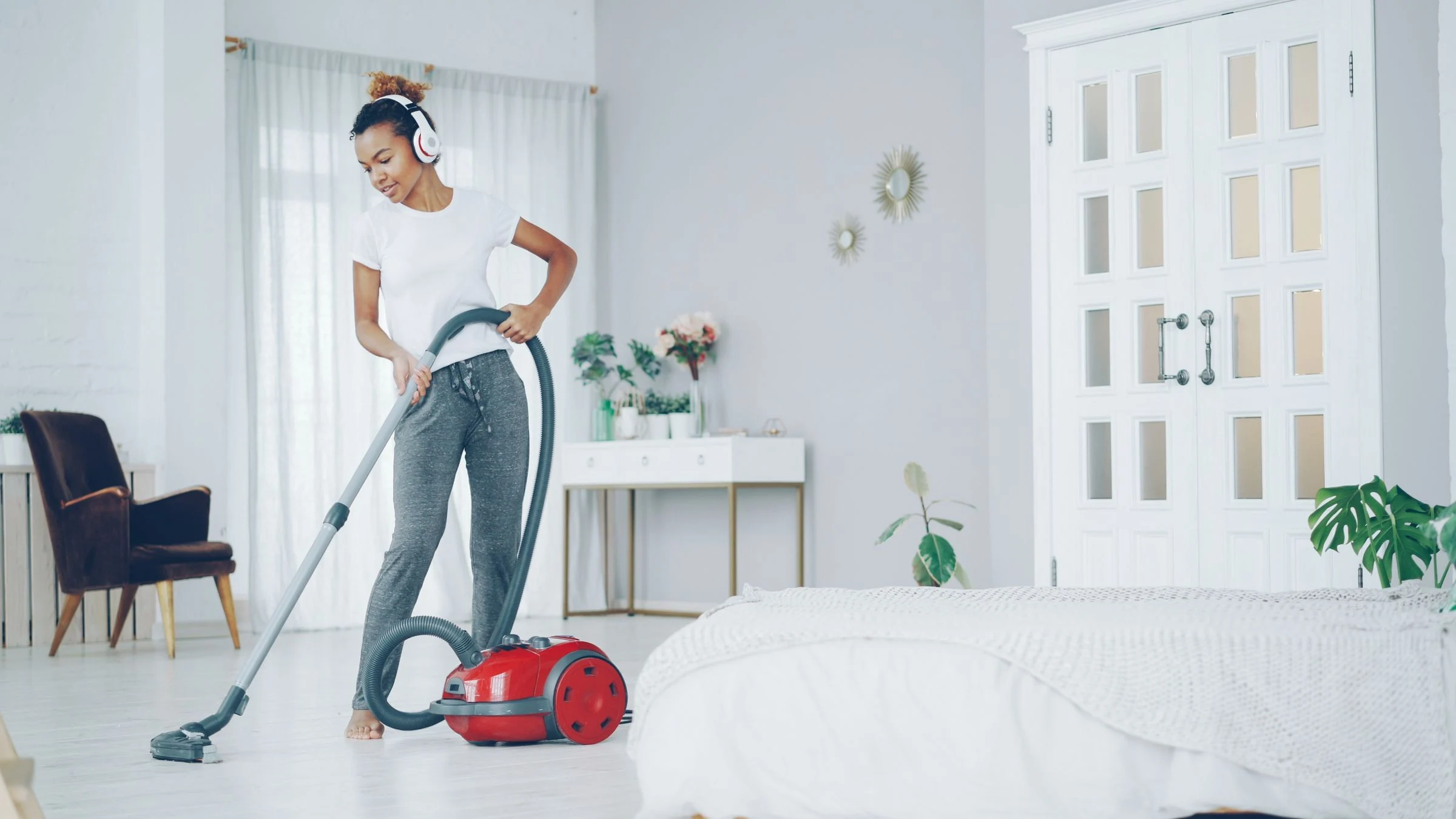 Cleaner vacuuming a modern room